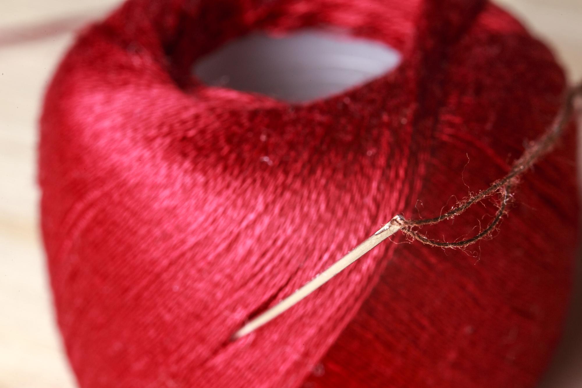 Close-up of hand embroidery threads and needle