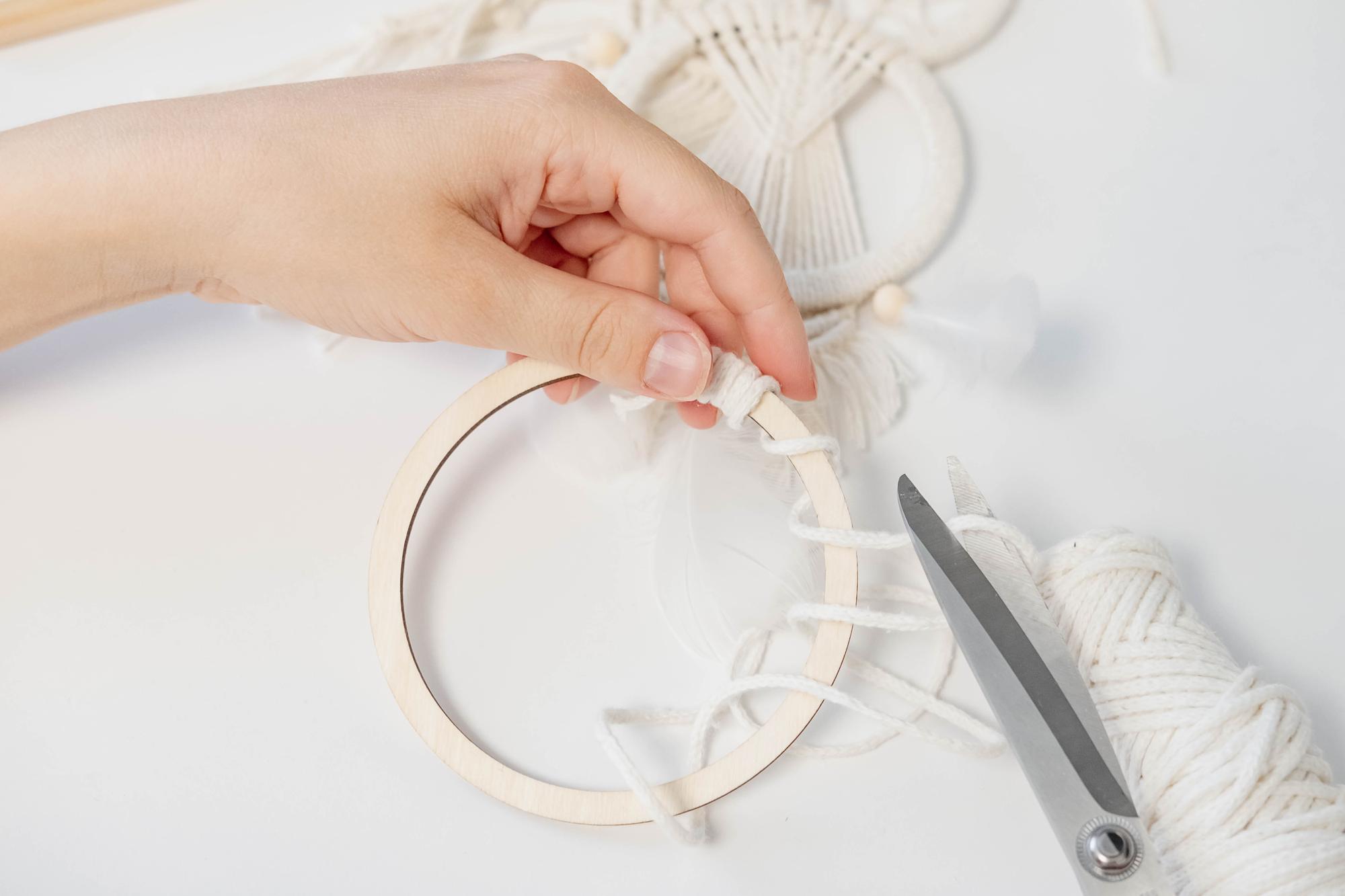 Student working on hoop with pattern
